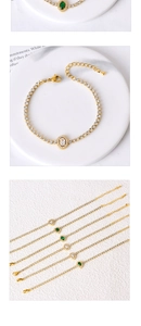 Detail of gold tennis bracelet with emerald and clear heart-shaped zircon stones