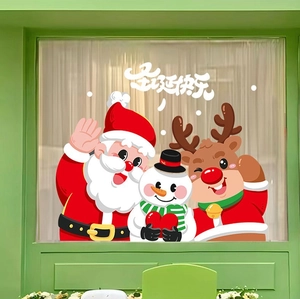 Détail d'autocollants statiques du Père Noël, du bonhomme de neige et du renne sur vitre