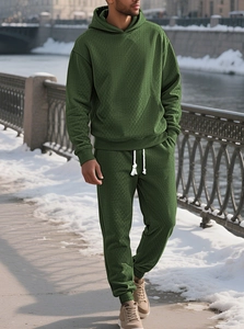 Close-up of deep green men hoodie set featuring high-quality diamond jacquard texture fabric