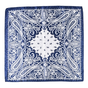 Flat lay of square satin scarf showing detailed blue and white paisley pattern