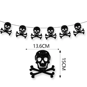 Detail showing dimensions 13.6cm x 15cm of black glitter skull Halloween party banner