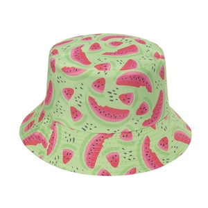 Reversible bucket hat featuring light green fabric with cute pink watermelon patterns