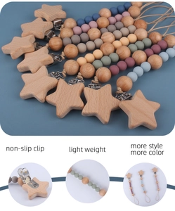 Detail showing non-slip beech wood clips and colorful silicone beads on baby pacifier chains