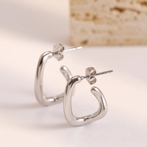Minimalist irregular C-shape silver titanium steel hoop earrings with polished mirror finish