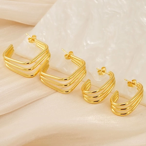 Detailed view of 18K gold plated triple layered geometric stainless steel stud earrings