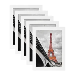 Set of 5 minimalist white wood photo frames featuring Eiffel Tower art for home decor