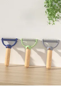 Detail of stainless steel double-sided blades on a pet de-shedding comb with wooden handle