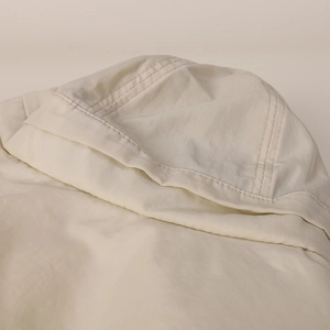 Detail of the reinforced stitching on the wide brim of this cream nylon sun hat