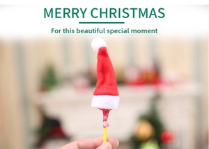 Close-up of mini red and white non-woven Christmas hat decoration for lollipop or candy