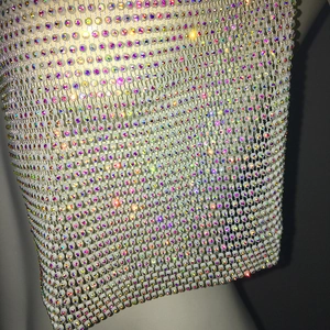Macro detail of elastic rainbow AB rhinestone mesh headpiece with sparkling crystals