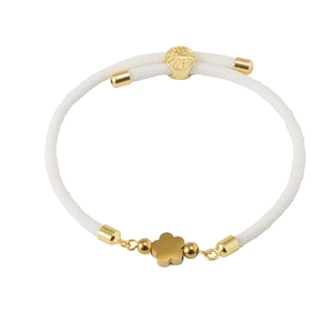 White woven bracelet with 18K gold-plated quatrefoil flower charm and adjustable closure