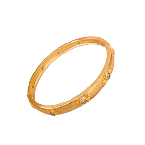 Vintage 24K gold plated flower buckle bangle with etched sunburst and zircon stones