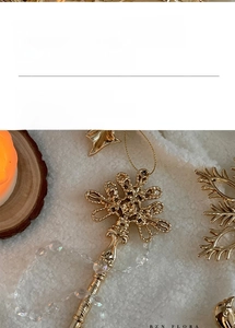 Detailed view of festive golden Christmas ornaments with snowflake and reindeer motifs