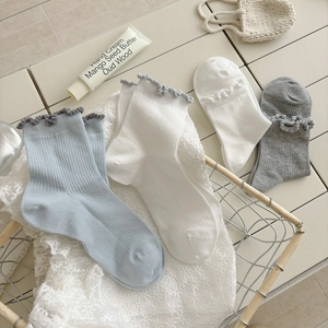 Women's ruffle trim cotton crew socks in blue white and grey soft ribbed texture