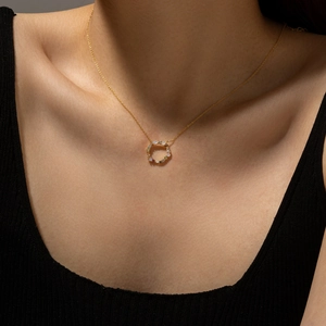 Elegant 925 sterling silver necklace with a round opal inlay pendant on a gold chain