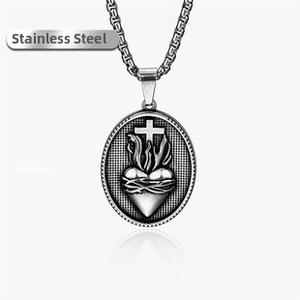 Macro view of stainless steel Sacred Heart of Jesus pendant with vintage texture
