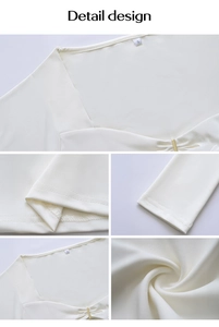 Détails du haut blanc avec garnitures métalliques dorées et texture de tissu lisse