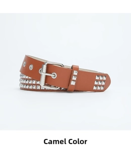 Close-up of camel leather belt with silver pyramid studs and metal eyelets details