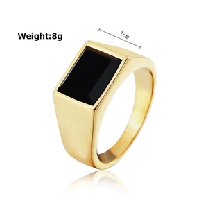 Macro view of gold stainless steel signet ring with rectangle black stone and 1cm width