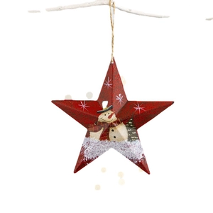 Red iron star Christmas ornament with snowman pattern hanging on white branches