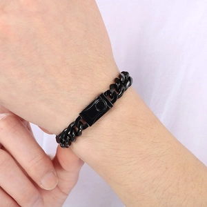 Close-up of 10mm black Cuban link bracelet with rectangular clasp on model's wrist