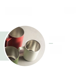 Macro shot of smooth polished stainless steel rim on colorful matte insulated mugs