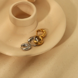 Lava texture stainless steel hoop earrings in gold and silver finish with organic ripples