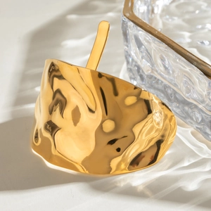 Modern gold-tone hammered stainless steel hair pin with irregular wavy texture