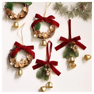 Christmas ornaments featuring velvet bows, golden bells, and pine cones on cream background