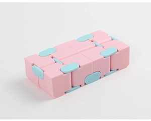 Detailed close-up of pink and blue infinity cube fidget toy for stress relief