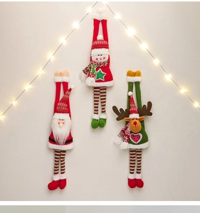 Detail view of plush long-legged Santa, Snowman and Reindeer dolls with warm LED lights