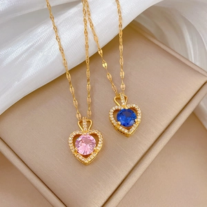 Luxurious gold heart necklaces with pink and blue gemstones and micro-diamond borders