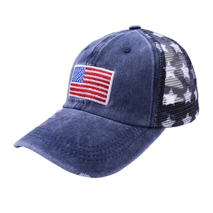 Distressed US flag baseball cap with mesh back and white star patterns on navy cotton
