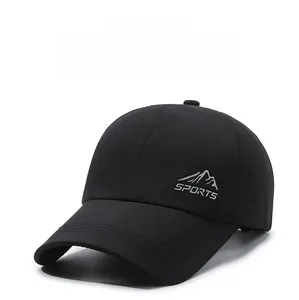Detail of a black breathable baseball cap with embroidered mountain logo and sports text