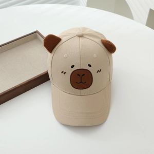 Detail of beige cotton kids baseball cap with 3D ears and cartoon embroidery