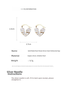 Detail view of heart hoop earrings with zircon flowers and dimensions 2.3cm by 1.7cm