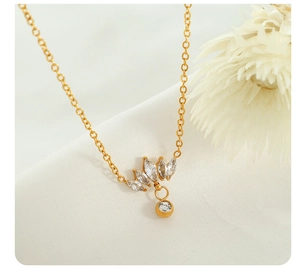 Detail of 18K gold plated necklace with marquise and round cut crystal pendant