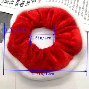 Detail view of red velvet Christmas scrunchie with dimensions 12cm outer and 5cm inner diameter