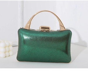 Detail of glitter evening clutch with polished gold metal handle and dark green finish
