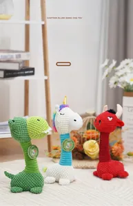 Plush squeaky dog toys in dinosaur and unicorn shapes with textured corduroy fabric details
