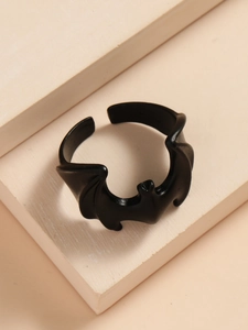 Detailed view of the matte black gothic bat ring with an adjustable open design band