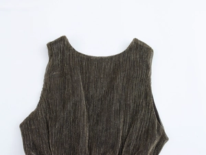 Detail shot of the vertical pleated texture and bronze shimmer on this deep V-neck dress