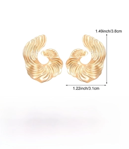 Detail view of gold spiral geometric earrings with size and weight specifications