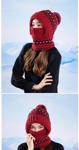Close-up of winter knitted balaclava with warm fleece lining and faux fur pompom detail