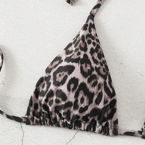 Detailed close-up of leopard print triangle bikini top with pleated edges and thin ties