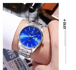 Detail of Tingxi men's quartz watch with blue sunray dial and silver steel strap