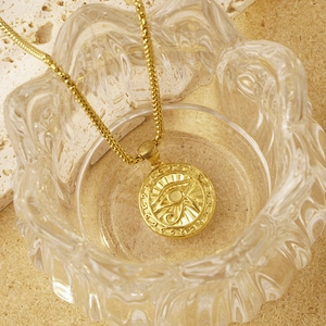 Collana in acciaio inossidabile dorato con ciondolo egiziano Occhio di Horus vintage