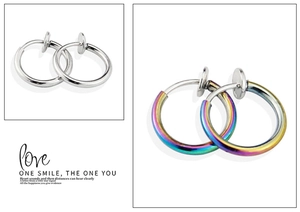 Detail view of silver and rainbow spring ear clips for non-pierced ears in punk style