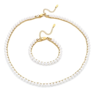 Elegant gold-tone layered stainless steel necklace and bracelet set with white pearls
