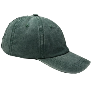 Detail of vintage washed dark green cotton baseball cap showing fabric texture and stitching